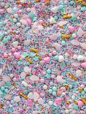 VARIETY SHAPED SPRINKLES INCLUDING RECTANGLE STAR ROUND HEART, ARROW, ROSE SHAPED. PASTEL COLOURS INCLUDING WHITE LIGHT PINK GOLD LAVENDAR LIGHT BLUE TEAL