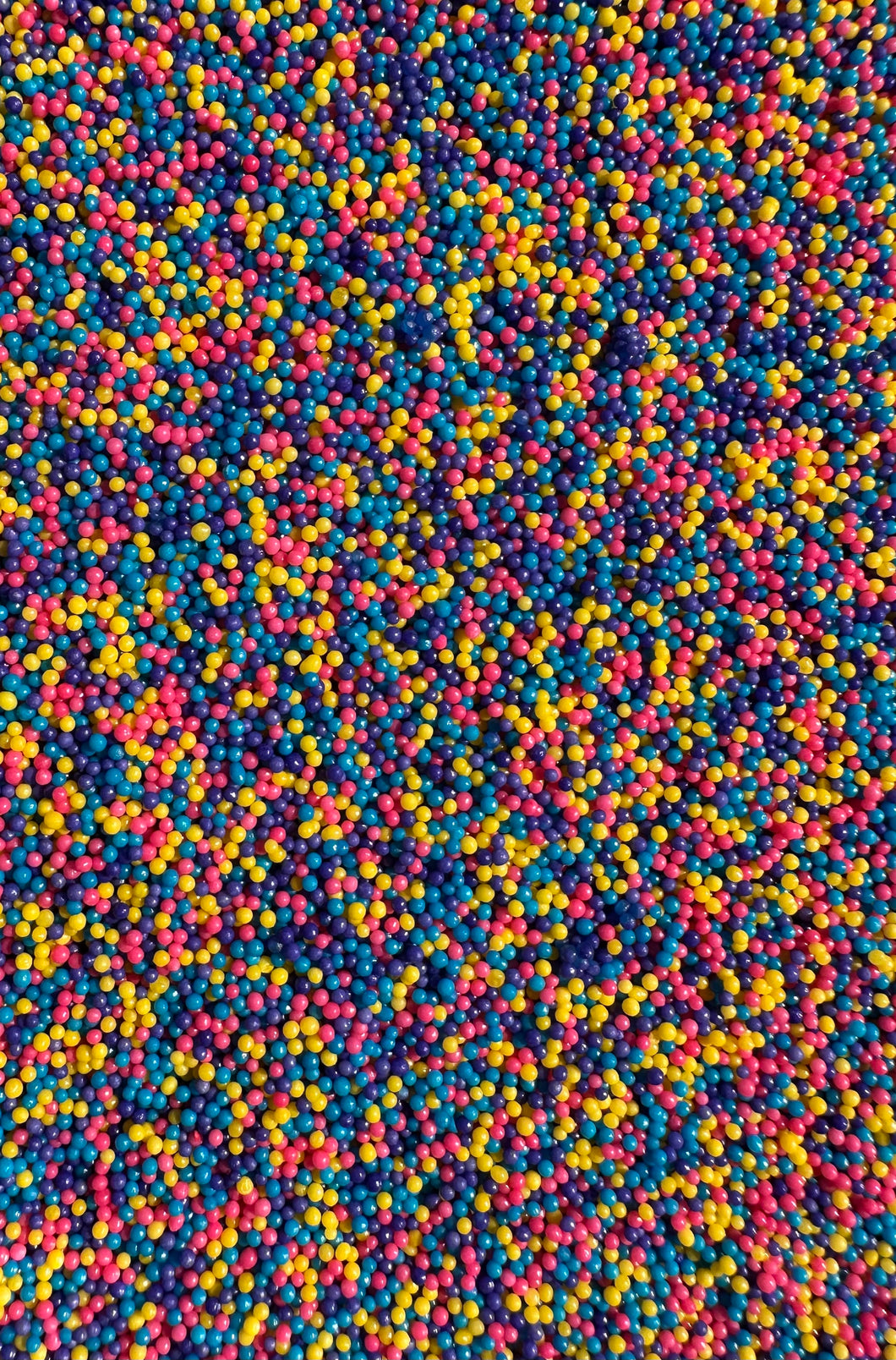 blue, yellow, pink and purple nonpareil sprinkles